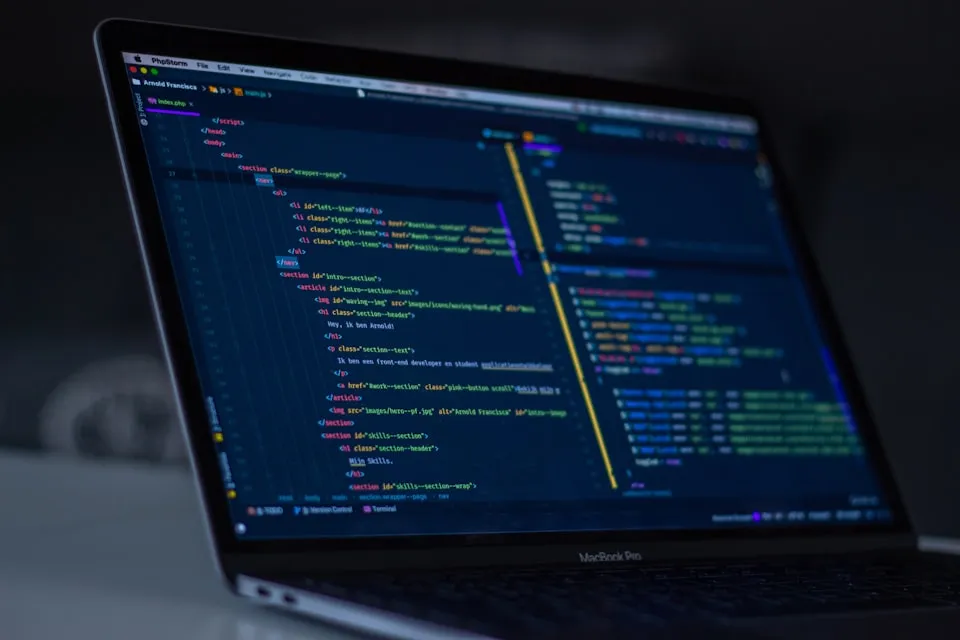 Close-up of a code editor with syntax highlighting on a screen.